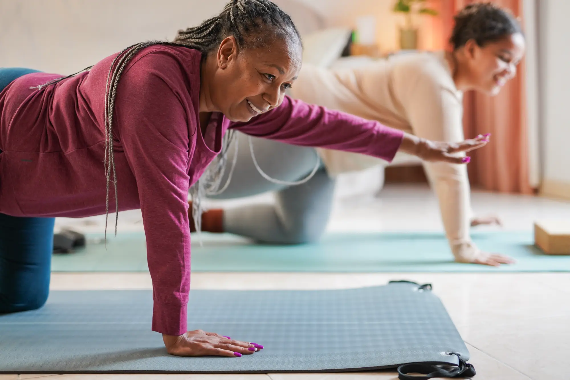 A woman in yoga class after a shoulder replacement