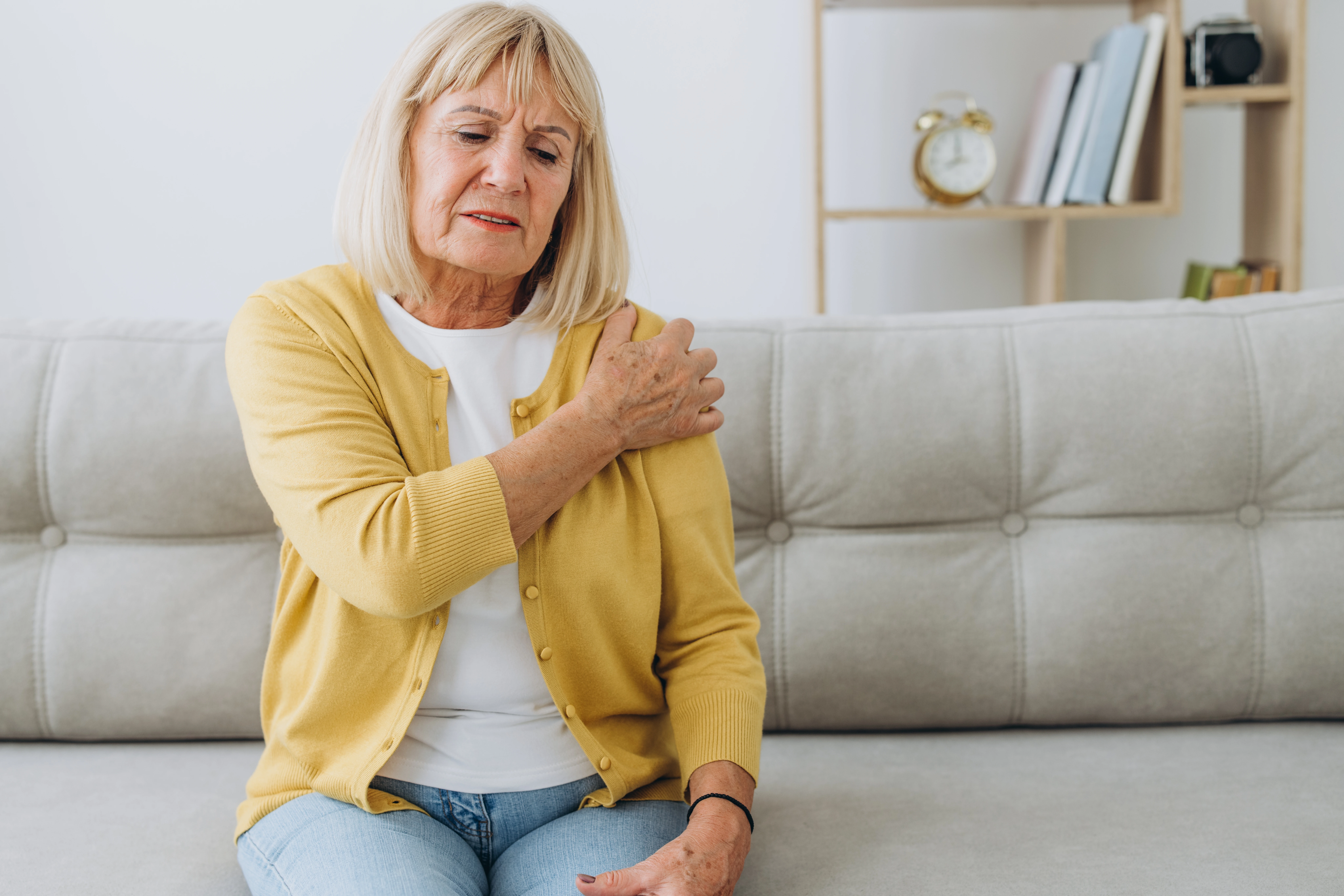 Senior patient with shoulder injury, deciding between shoulder replacement vs non-surgical treatment options.