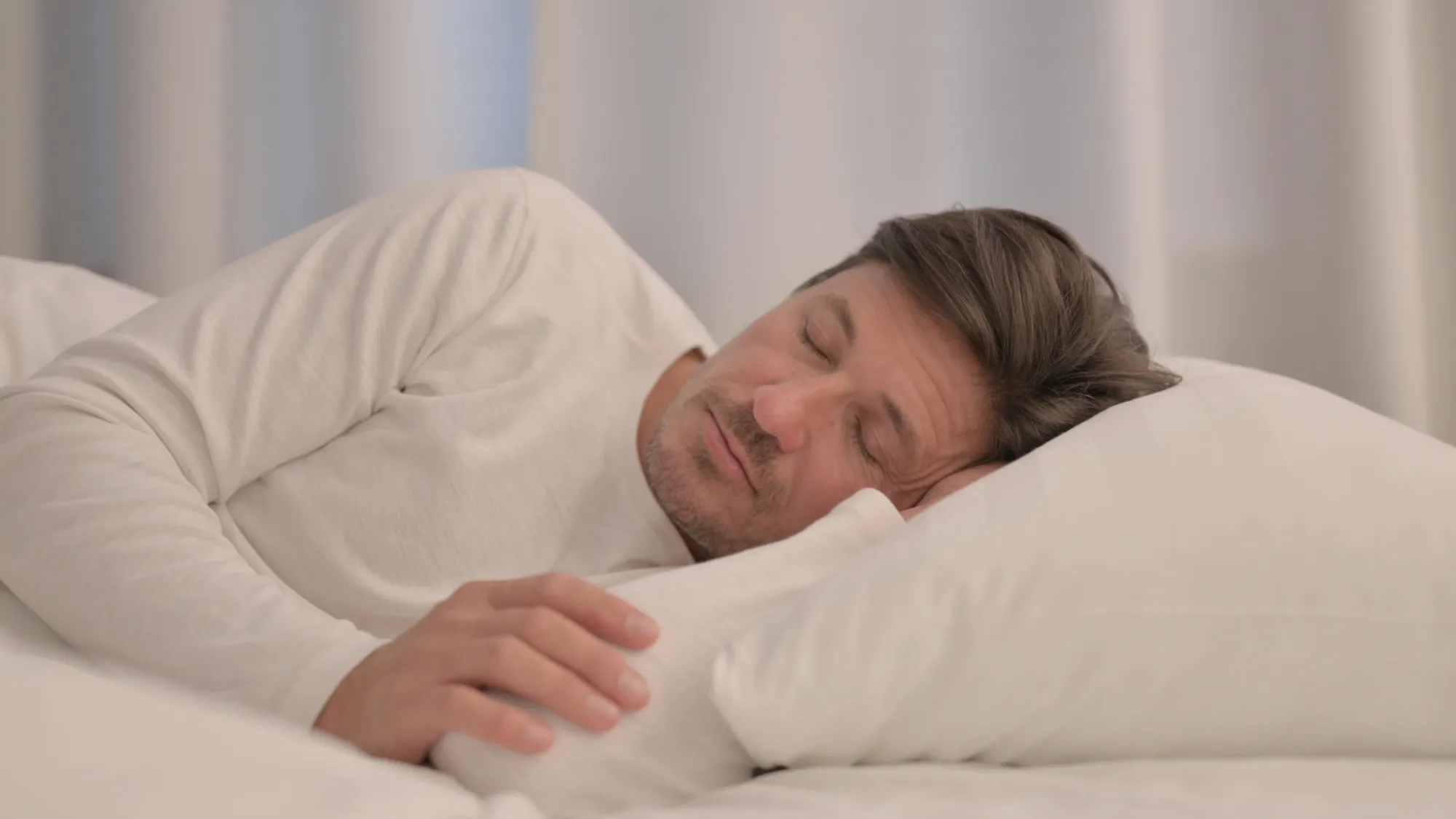 patient experiencing shoulder problems due to sleeping on his side.