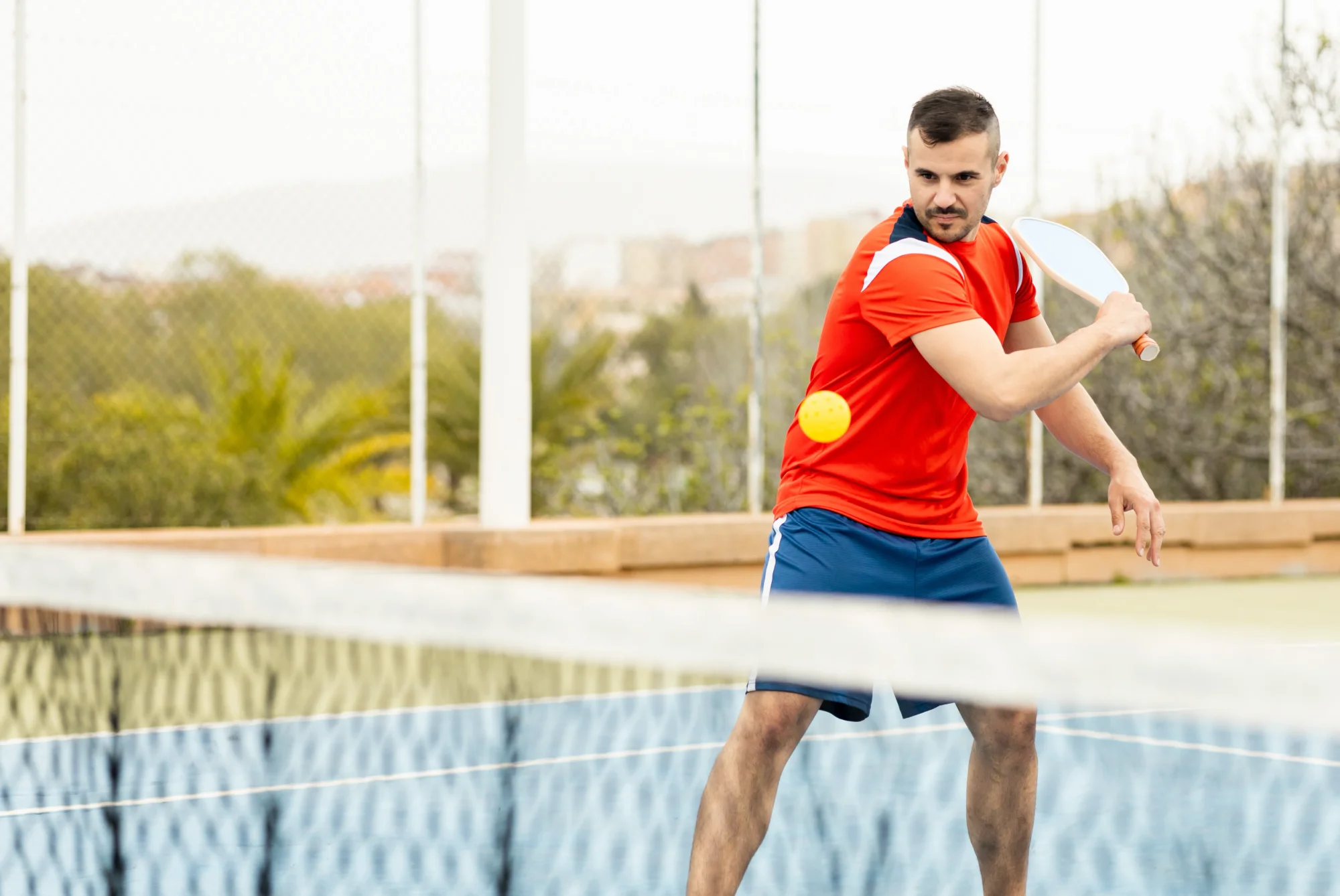 Person playing pickleball after recovering from shoulder surgery